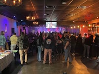 a crowd of people at a bar
