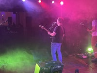 a group of people on stage at a concert