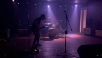 a group of people on stage in a dark room